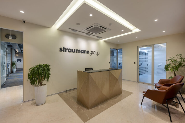 Modern corporate reception desk and lobby with warm ambient lighting