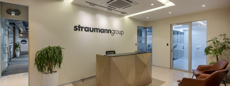 Modern corporate reception desk and lobby with warm ambient lighting
